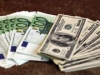 Доллар дешевеет к евро после публикации протокола заседания ЕЦБ
